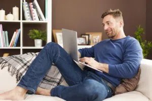 shutterstock_chap-relaxing-with-laptop-300x199