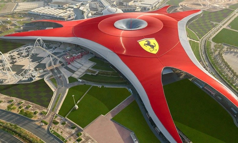Aerial view of Ferrari World Abu Dhabi with its iconic red roof and racetrack