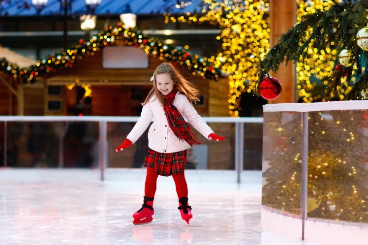 happy kid doing ice skating
