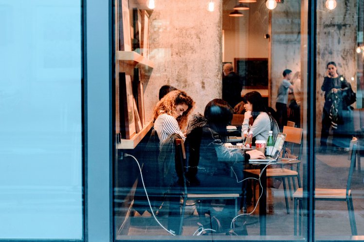 Coporate person working in coffee shop