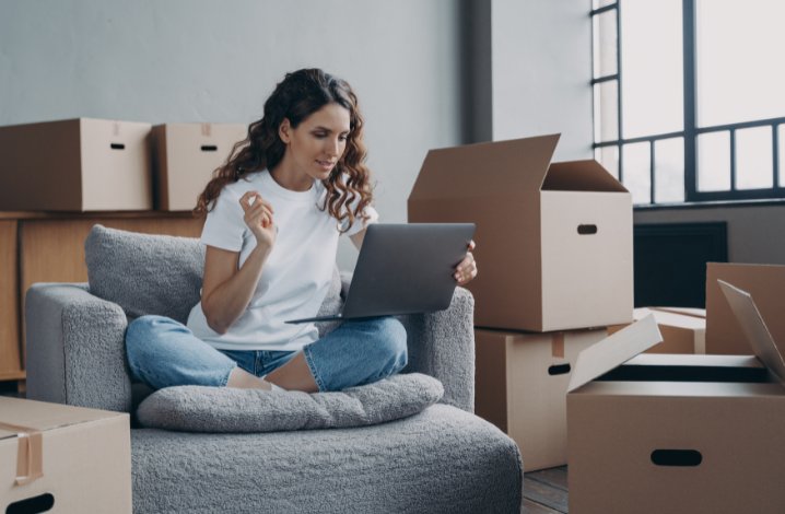 Employee managing housing arrangements during relocation while preparing to start a new role.