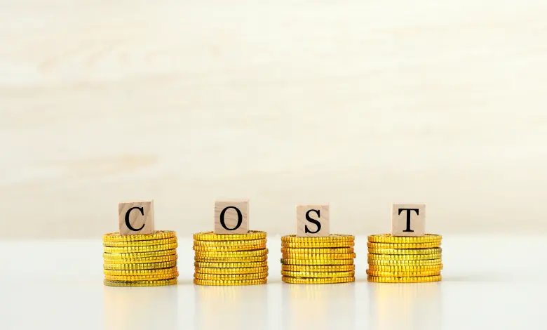 Cost of living in Houston represented by stacked coins and cost text