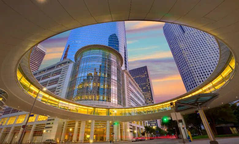 Downtown Houston skyline with modern buildings and city streets at sunset