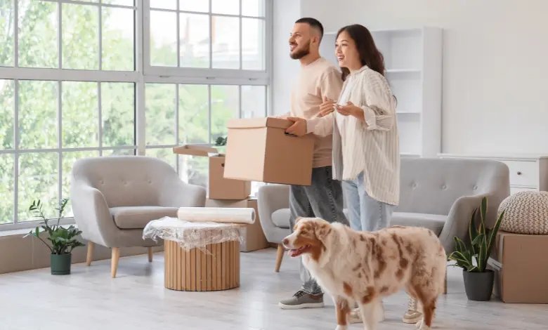 Couple moving into a new home with their dog