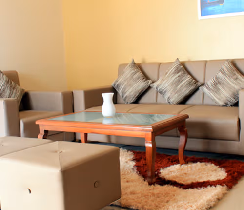 Simplistic living area in Rakshak Nagar Apartments
