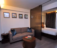 King sized bedroom at Queens Rd East Apartments