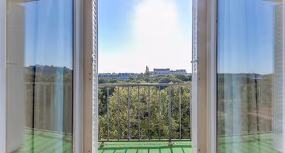 A BALCONY THAT OVERLOOKS ESPLANADE DES INVALIDES-A STUNNING EIFFEL HOME