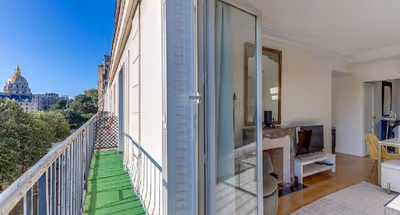 A BALCONY THAT OVERLOOKS ESPLANADE DES INVALIDES-A STUNNING EIFFEL HOME