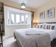 King sized bedroom at Milburn Crescent