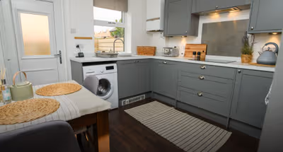 Fully equipped kitchen at Stunning 2 Bedroom Home | Free Parking and Wifi