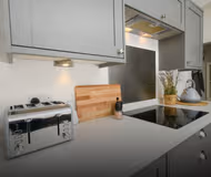 Fully equipped kitchen at Stunning 2 Bedroom Home | Free Parking and Wifi