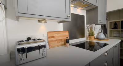 Fully equipped kitchen at Stunning 2 Bedroom Home | Free Parking and Wifi