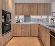 Fully equipped kitchen at Liverpool Street Apartments by MySquare