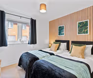 Luxury bedroom at 12 Tatler Close (Oak House)