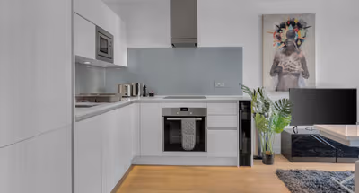 Kitchen at Studio in Avant Garde Apartments