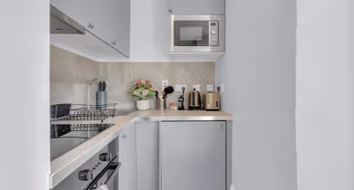 Fully equipped kitchen in Studio apartment at Lena Extended Stays Residences by MySquare