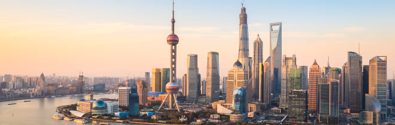 Shanghai skyline with oriental pearl tower and modern skyscrapers at sunset
