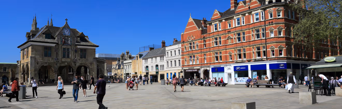 People roaming near Cathedral Square, Peterborough City, Cambridgeshire, England, UK