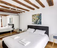 Le Raffinement Parisien – Elegant Two-bedroom Haven with Private Suites & Chic Living Spaces
