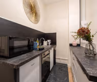 Elegant 5-Bedroom Parisian House with Air Conditioning, Two Kitchens, and Iconic City Access