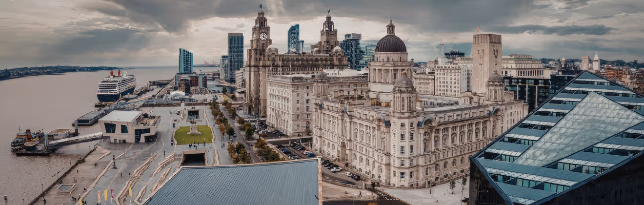 Liverpool waterfront skyline with River Mersey and historic buildings