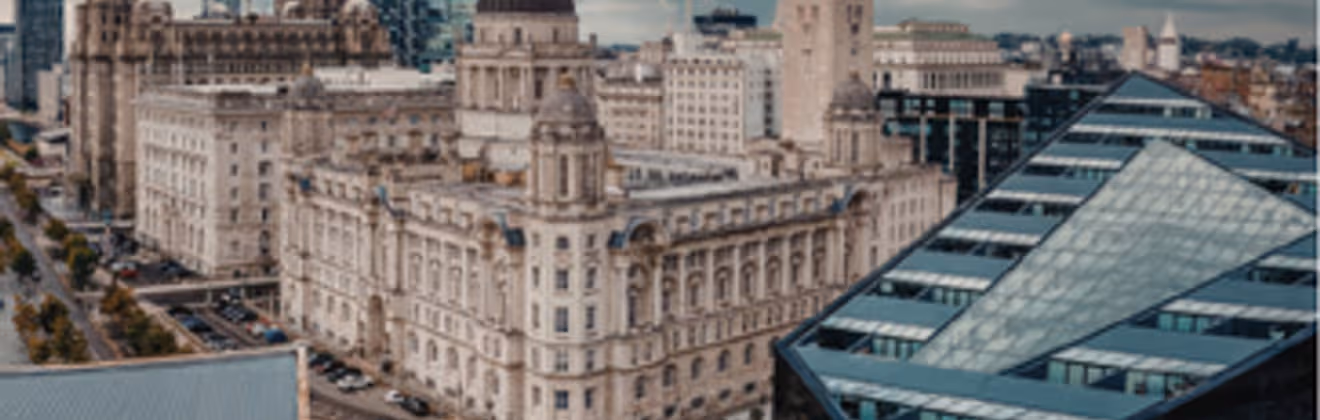 Liverpool Royal Liver Building and waterfront skyline viewed from a bedroom apartment window