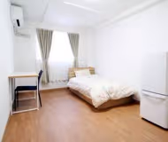 Simplistic living area in Nishiguchi Apartments