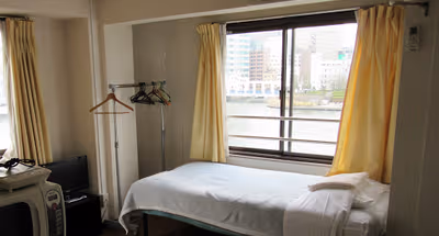 Simplistic living area in Koto-Ku Serviced Apartment