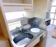 Simplistic living area in Shin Yokohama Apartments