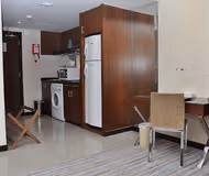 Fully equipped kitchen at Airport Road Serviced Apartments, Al Nahyan