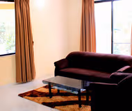 Simplistic living area in Kalyani Nagar Apartments
