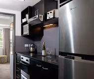 Full kitchen at Ponsonby Road serviced apartment