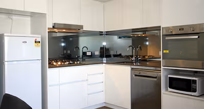 Fully equipped kitchen at Chetwynd Street Serviced Apartments in North Melbourne
