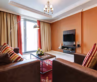 Simplistic living area in Dubailand Serviced Apartments, Dubai Land