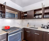 Fully equipped kitchen at West 50th Street Apartment, Manhattan