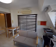 Simplistic living area in Minatoku Serviced Apartment