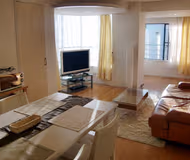 Comfy living area at SonezakishinchiKita Serviced Apartment