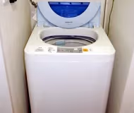 Simplistic living area in 27-Roppongi Apartments