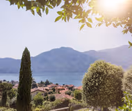 BASKING IN SUNSHINE WITH 180° LAKE VIEWS OVERLOOKING THE MAJESTIC MOUNTAINS & COMO