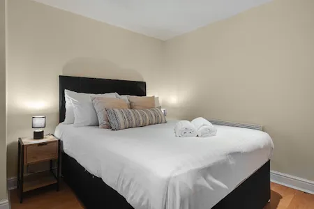 Bedroom at Short Term Rentals apartment