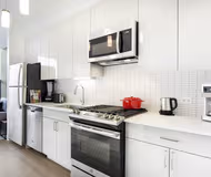 Fully equipped kitchen at Van Buren Street Serviced Apartment #1115 Serviced Apartment, West Loop