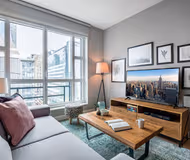 Spacious living area at W 28th Street Apartment