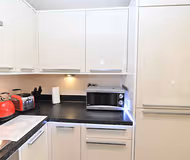 Fully equipped kitchen at Shelly Apartment in Watford