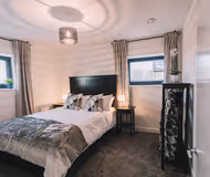 King sized bedroom at Bridge Square Apartments