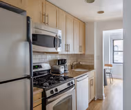 Fully equipped kitchen in 1 bed at East 33rd Street Apartment