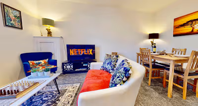 Living room at Funky 2 Bed Duplex Apartment in the Heart of Historic Rochester