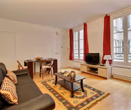 Simplistic living area in Rue Godot de Mauroy Serviced Apartment, Opera