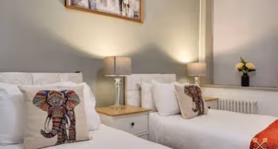 King sized bedroom at Queens Apartments