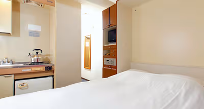 Simplistic living area in Nakajujo Apartments