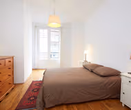 King sized bedroom at RUE RAFFET SERVICED APARTMENT